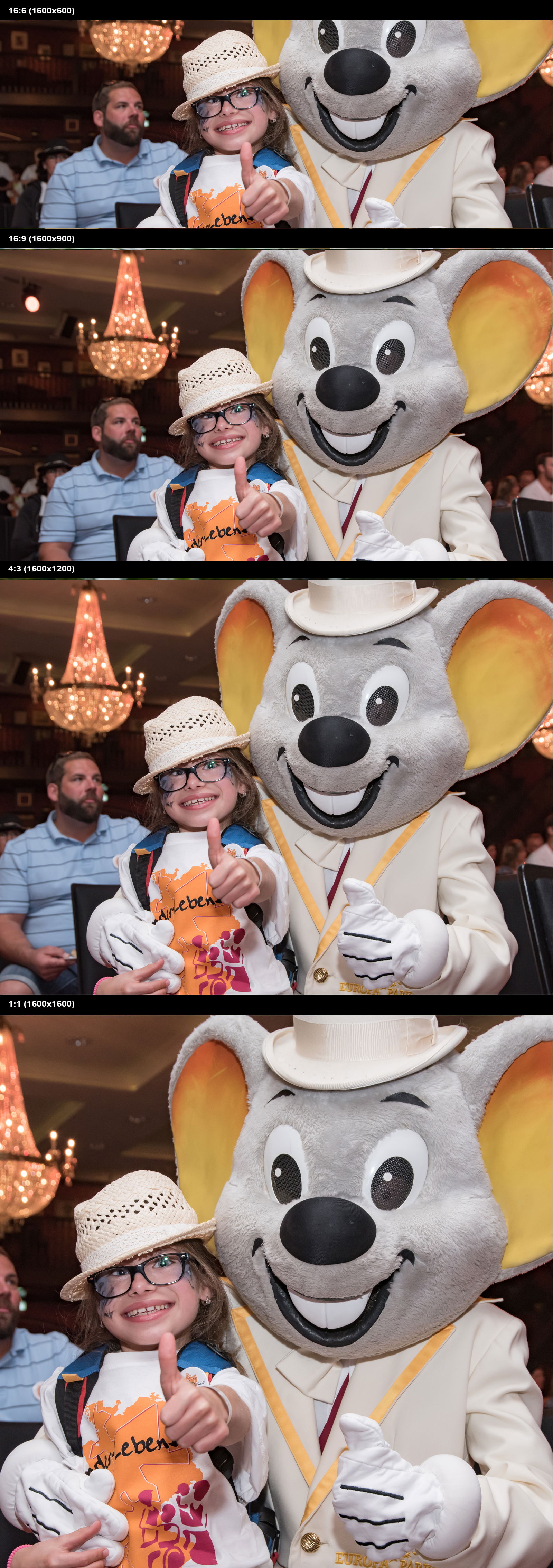 Lachendes Kind mit Europapark-Maus hält den Daumen hoch