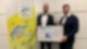 Michael Düpmann von der VR Bank Rhein-Neckar übergibt Spendenscheck an Tobias Heger von der ATSW