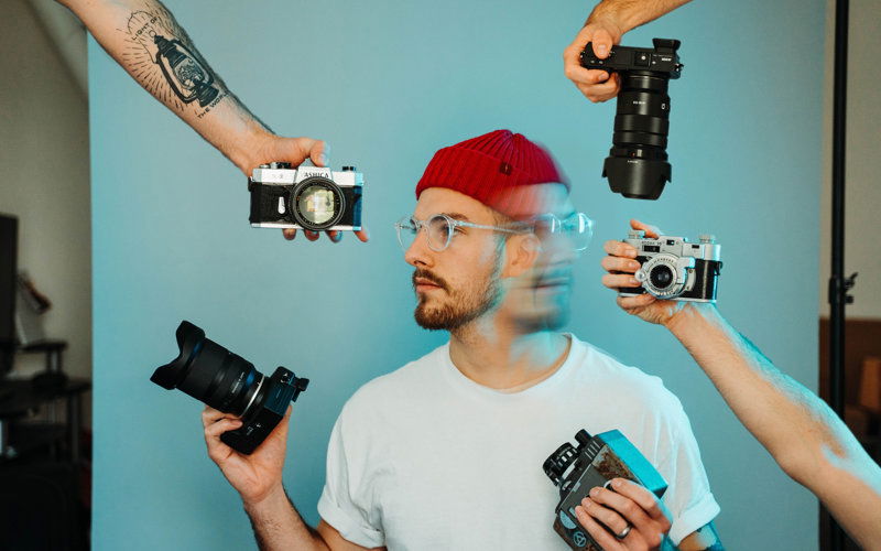 Fotograf viele Kameras