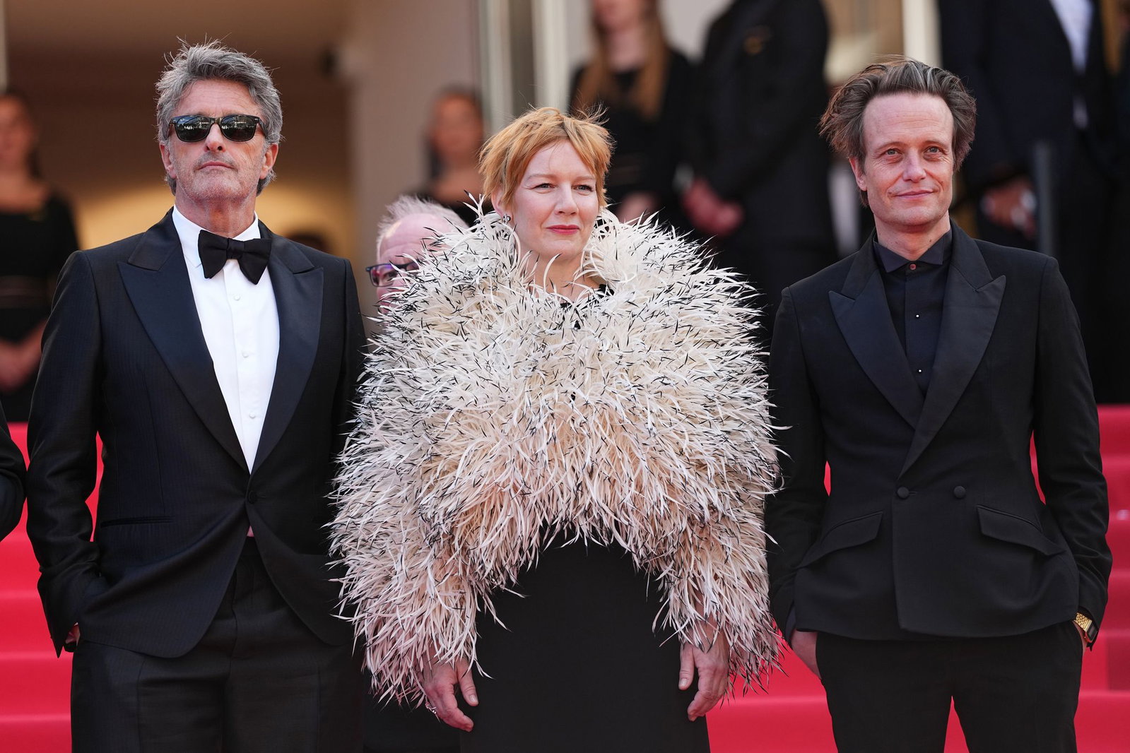 Pawel Pawlikowski, Sandra Hüller und August Diehl vor dem Festivalpalast in Cannes. (Archivbild)