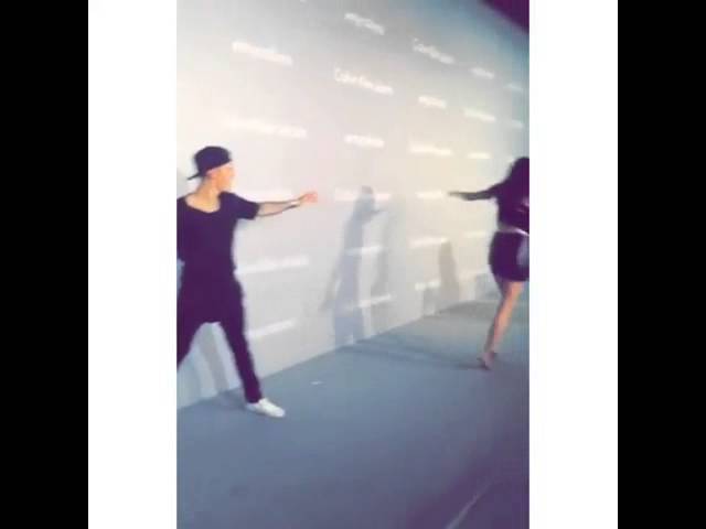 Justin Bieber and Kendall Jenner doing a cartwheel 