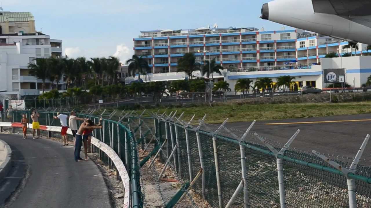 Girl blown by a plane