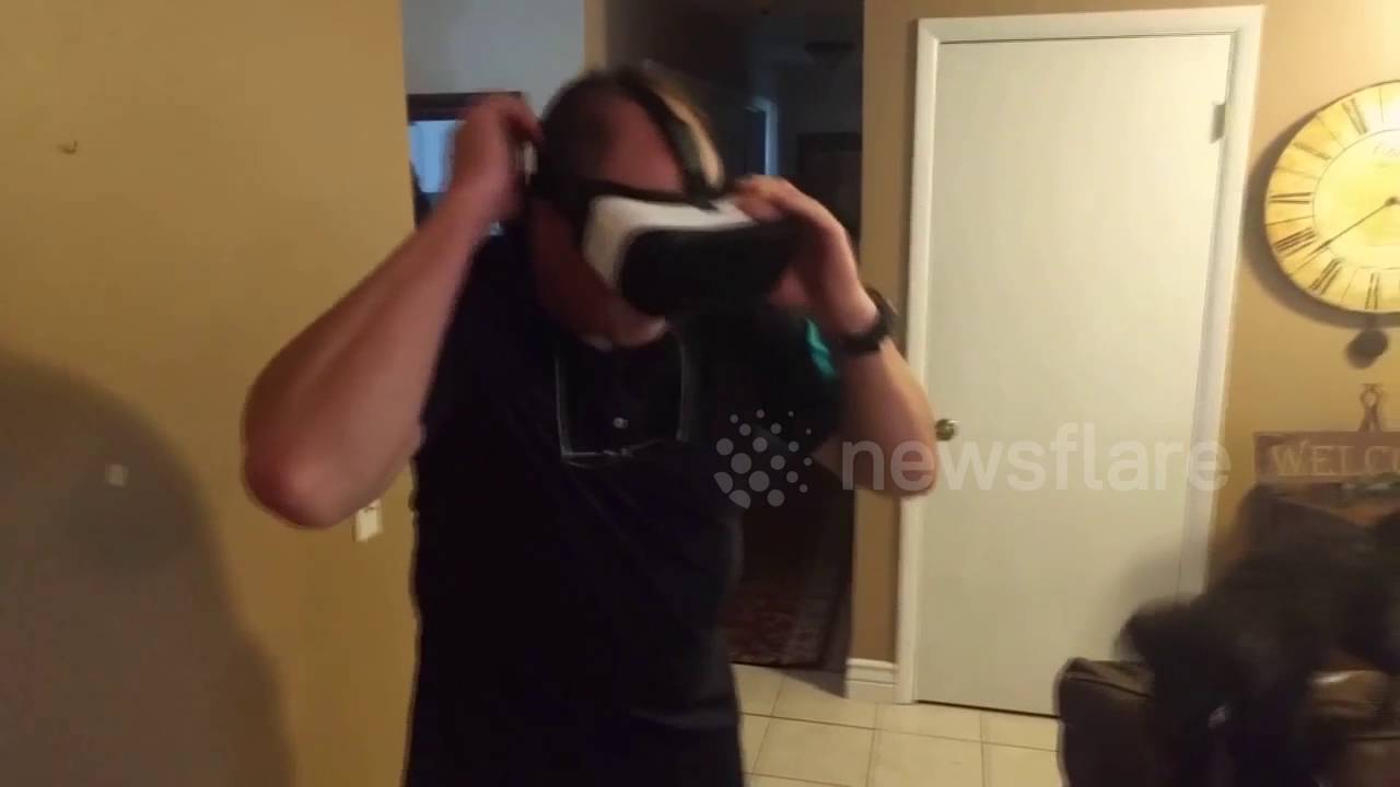 Father tries VR headset, breaks picture frame