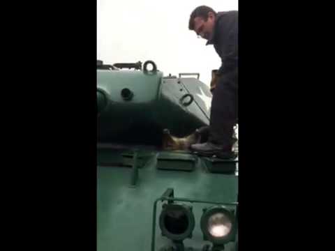 Raccoon Stuck in an Army Tank